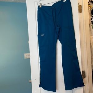 Bread new without tags. Never worn Caribbean blue (teal) wide leg scrub pants